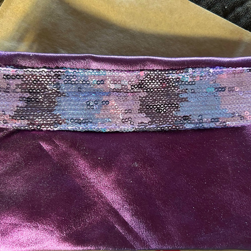 Purple and silver cosmetic bag.